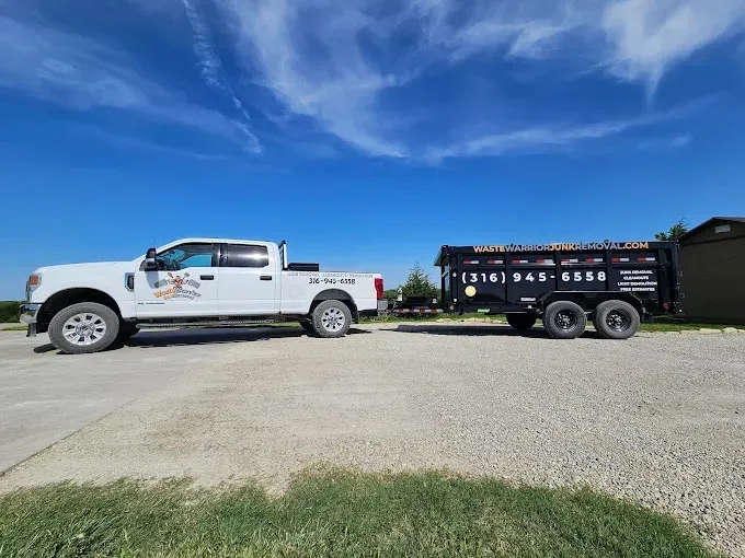 The image shows a white truck and a black trailer