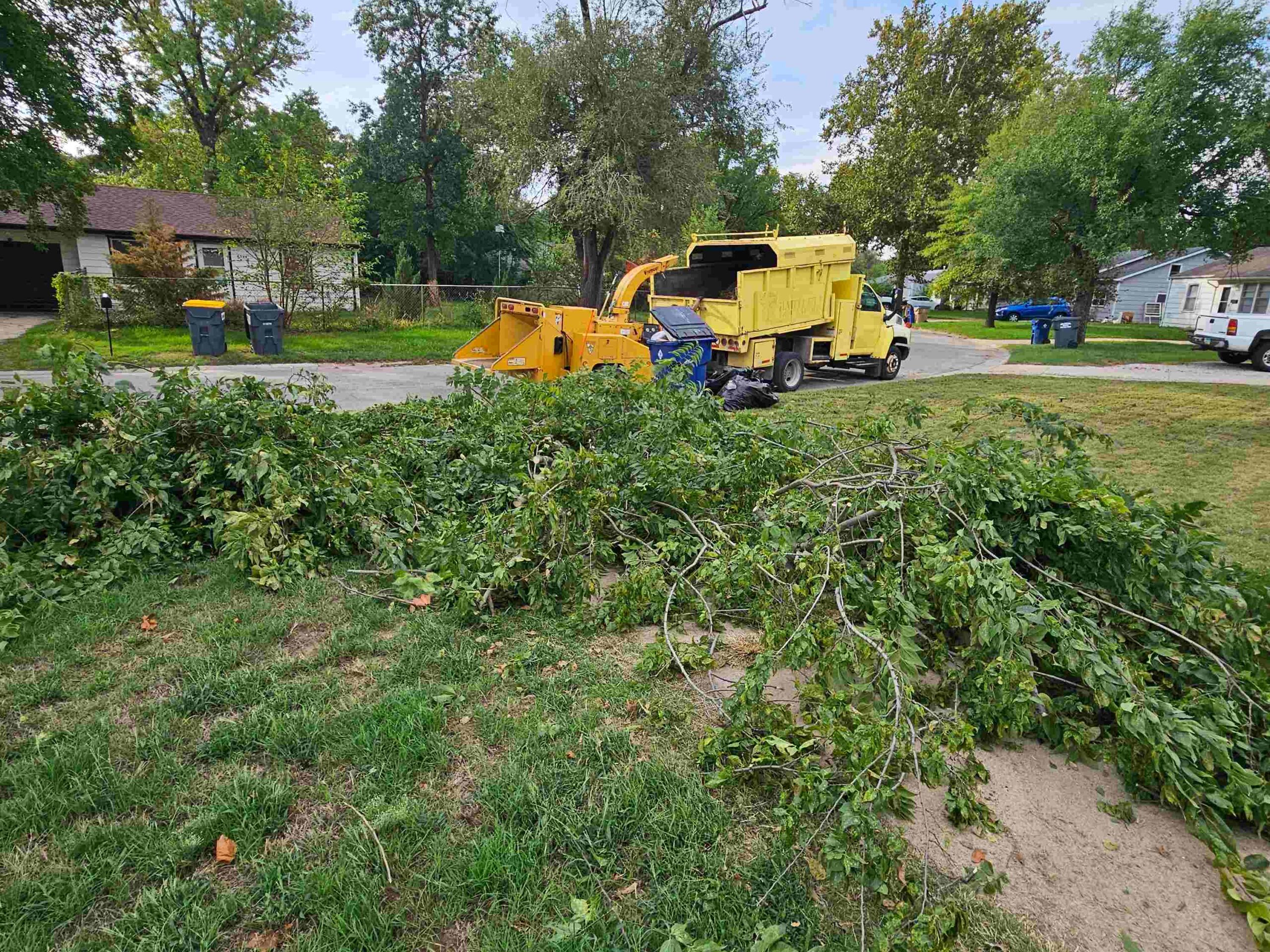 Pile of construction debris in front of a house